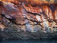 Red Stained Rock and Blue Water near Aappilattoq